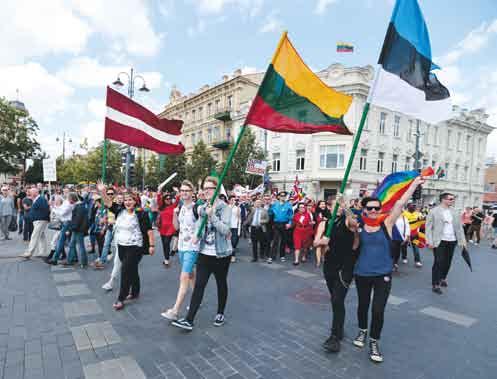 vėliavomis Participants of the March for Equality